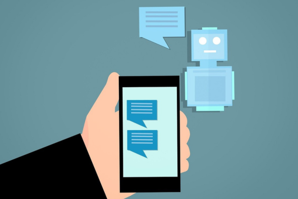 Illustration of hand holding a mobile phone with chat bubbles on the screen, and a robot and chat bubble floating in the air