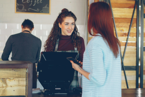 Small business owner with customer