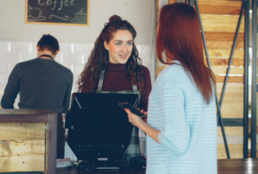 Small business owner with customer