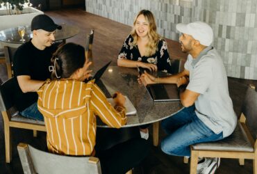 A group of four people sitting at a table