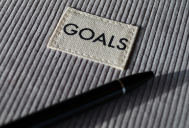 Notebook with "goals" written on it.