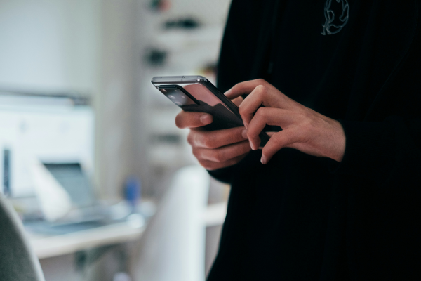 Person holding a mobile phone