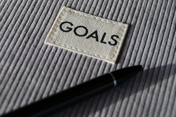 Notebook with "goals" written on it.