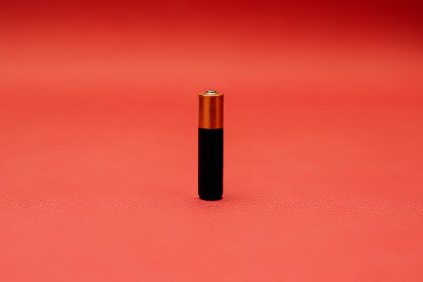 a battery on a red background